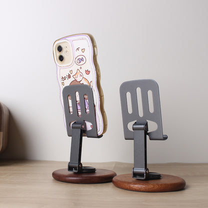 The new solid wood desktop mobile phone holder rotates 360 degrees, and the live broadcast is lazy and convenient to fold. Universal mobile phone holder