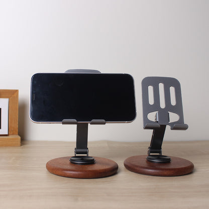 The new solid wood desktop mobile phone holder rotates 360 degrees, and the live broadcast is lazy and convenient to fold. Universal mobile phone holder